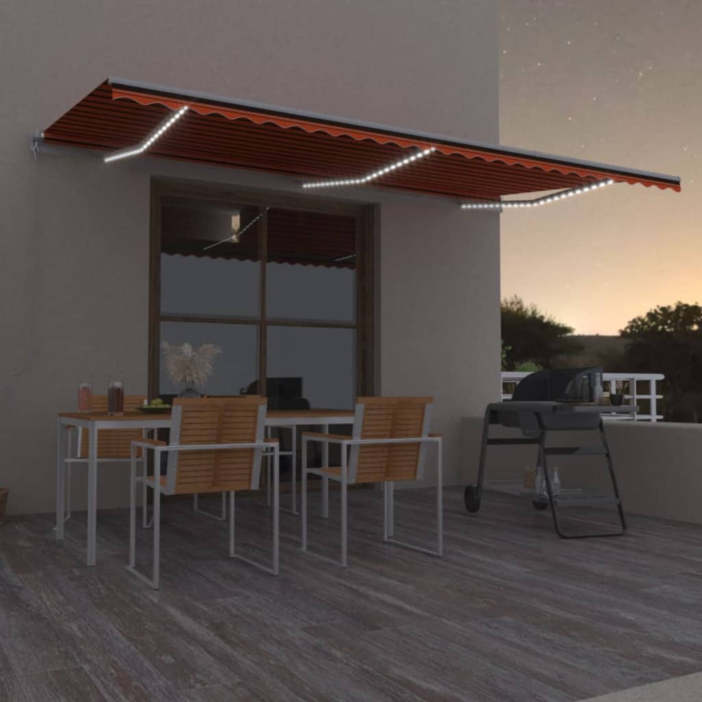 vidaXL Toldo manual retráctil con luz LED naranja y marrón 600x300 cm