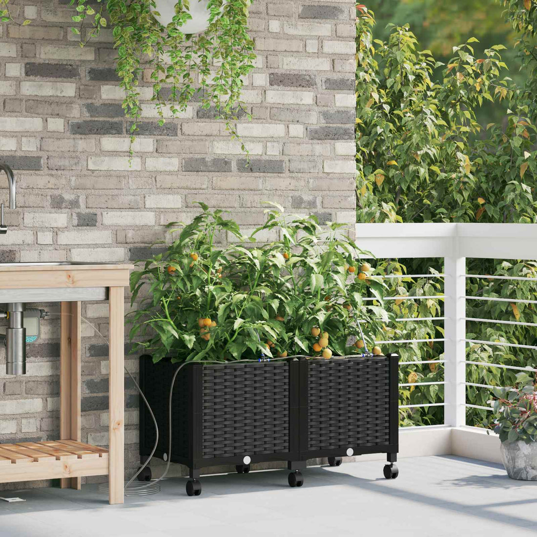 vidaXL Maceta de jardín con riego y ruedas 2 uds. Negro PP